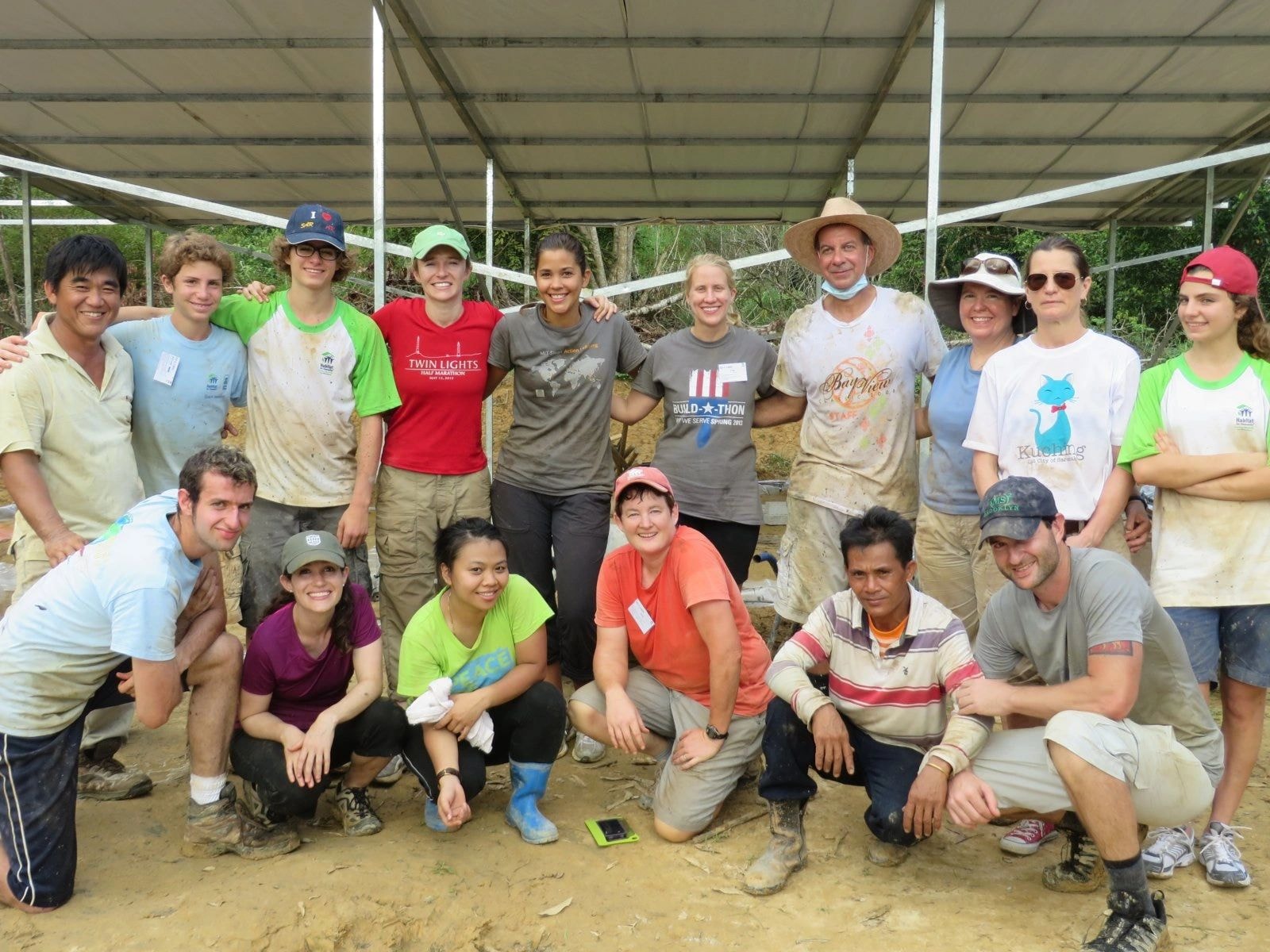 Large group of volunteers at outdoor construction site